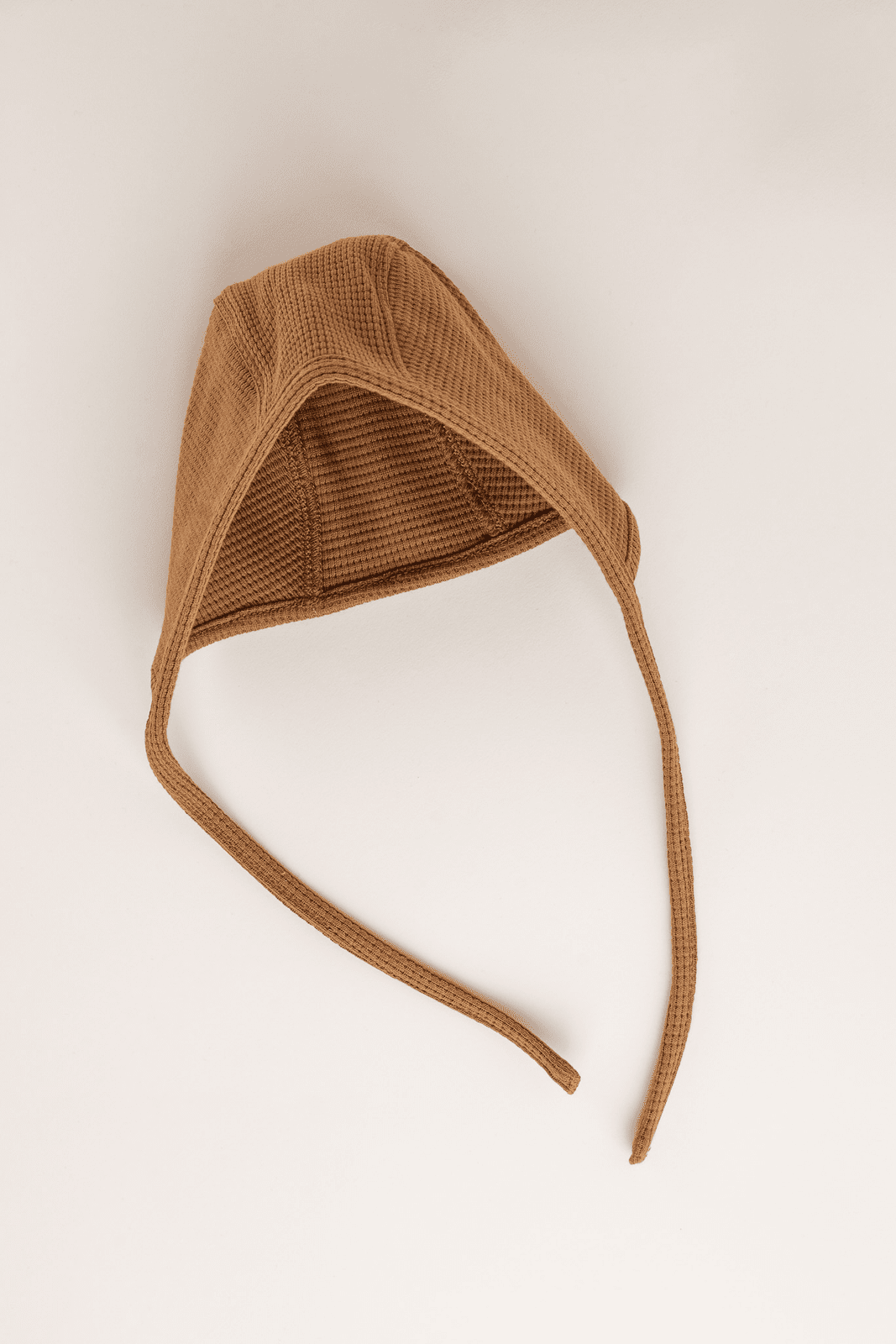 Knitted baby bonnet caramel