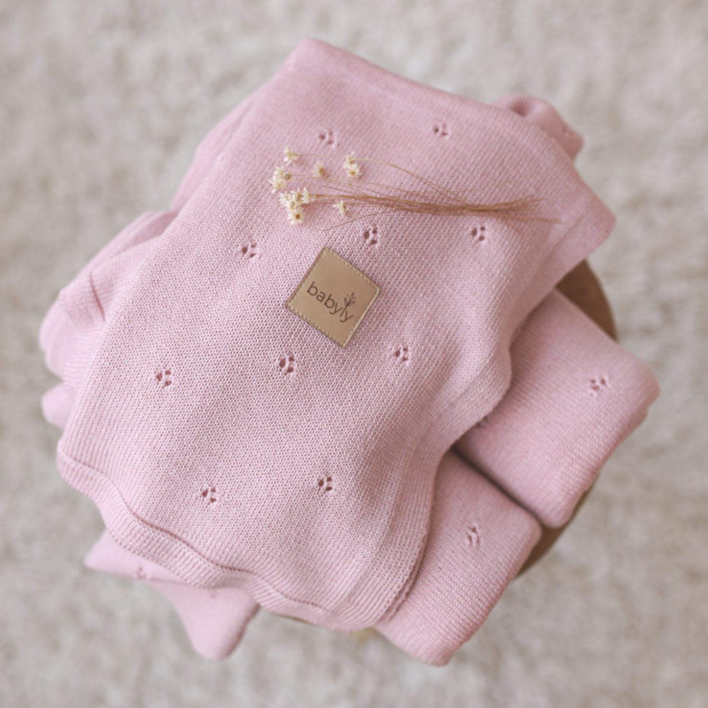 Manta de bebé em lã merino em malha rosa