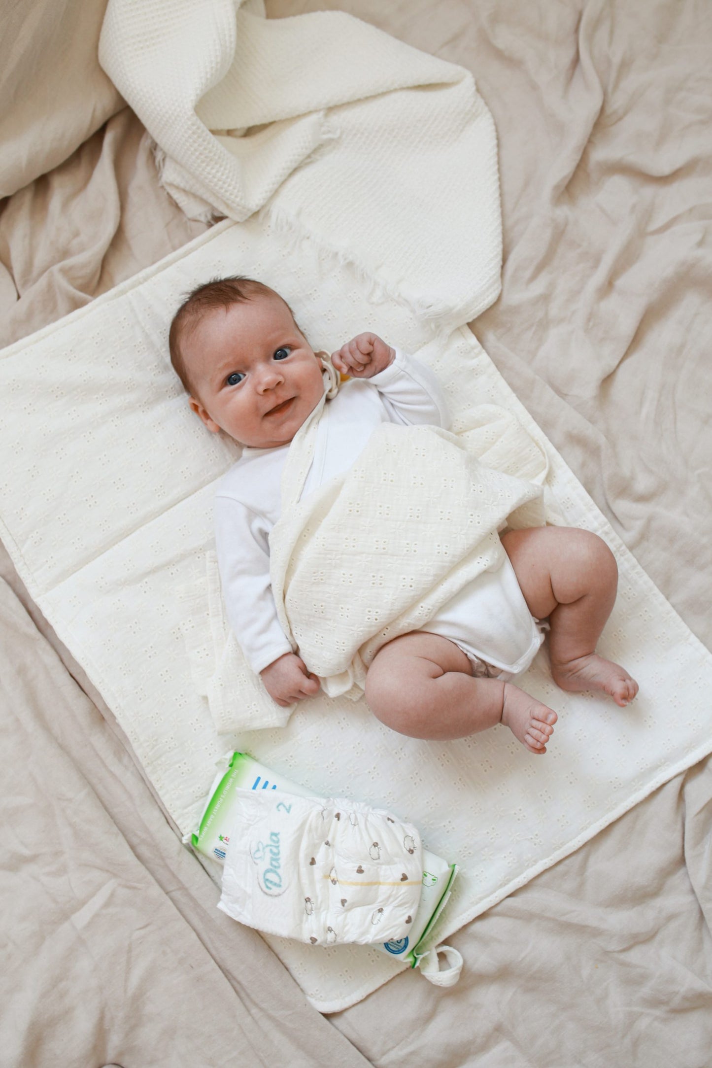 Raw embroidered muslin changing table