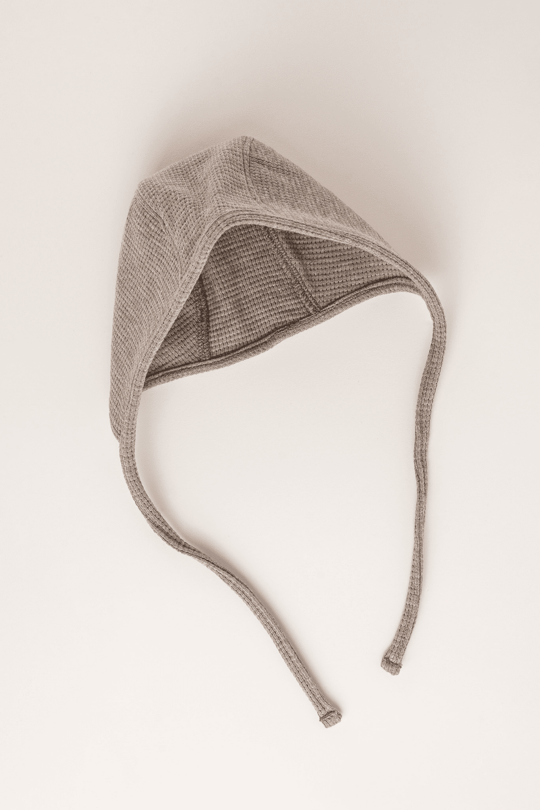 Beige knitted baby hat