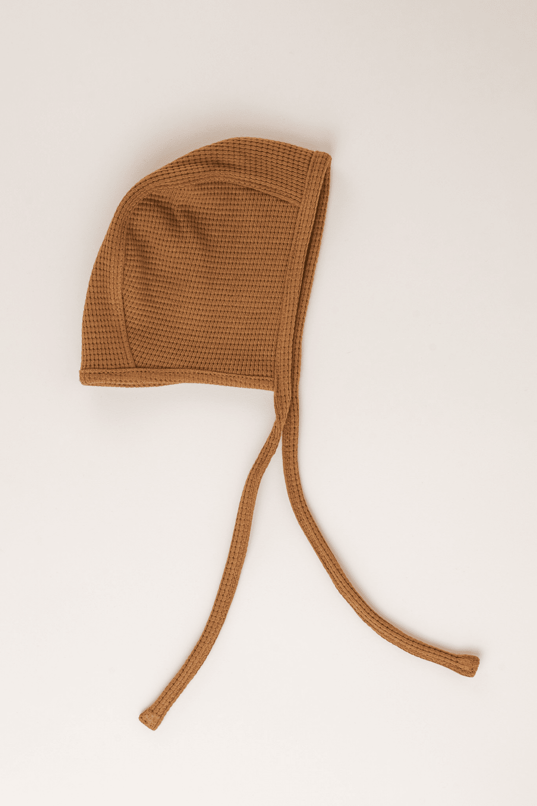 Baby hat in caramel knit