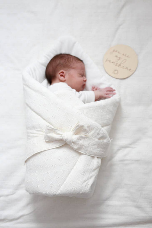 Raw embroidered baby wrap