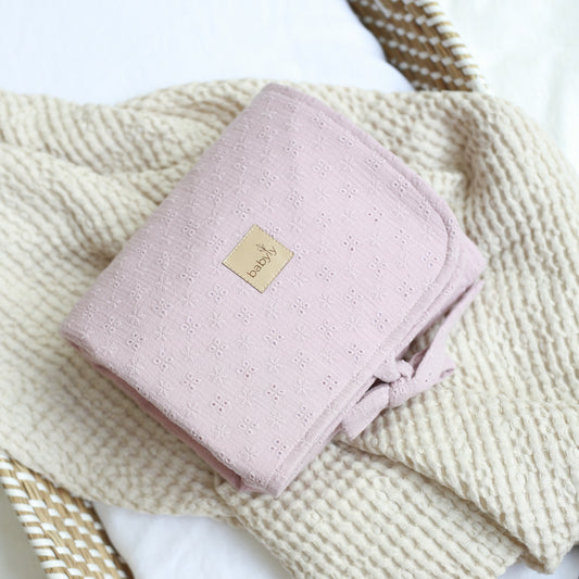 Pink embroidered muslin changing table