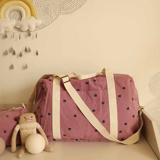 Bolso premamá rosa con corazones